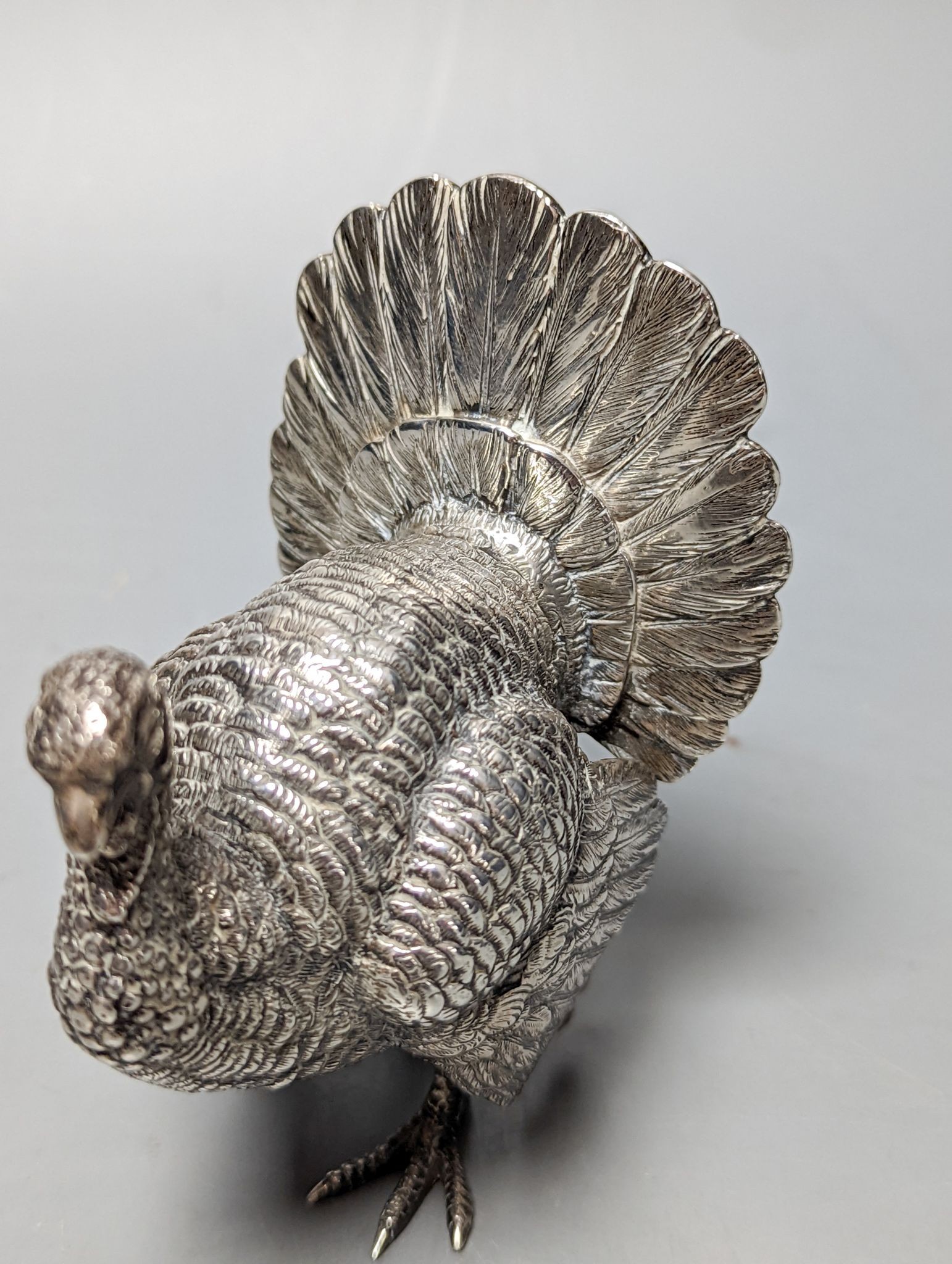 A late 19th /early 20th century Hanau silver free standing model of a game bird, 1930's import marks, height 10.4cm, 180 grams.